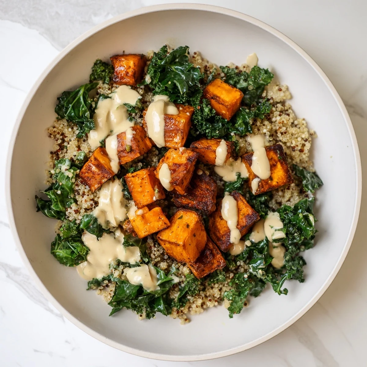 Light Coastal Bowl: a visually appealing dish of fluffy quinoa, sweet potatoes and kale.