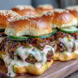 Fresh dill pickles add a tangy crunch to these savory game day bratwurst sliders.