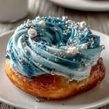 2. Stunning Galaxy Graduation Cake features marbled buttercream in cosmic hues and sparkling edible stars, ideal for a festive graduation dessert.