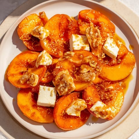 Enjoy a close-up of a rustic Peach and Ginger Crumble, perfect for any cozy, autumn gathering.