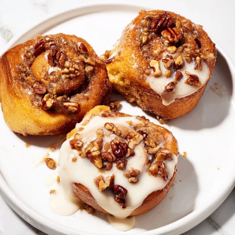 Warm and gooey Cinnamon Roll Monkey Bread, perfectly pullable, glistening with icing, a delightful brunch dessert.