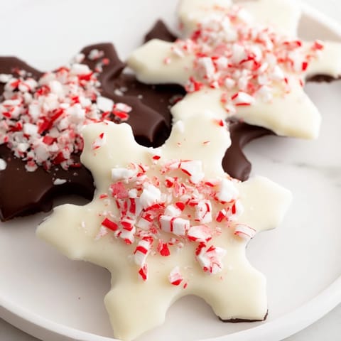 Festive Peppermint Bark Snowflakes: layers of chocolate topped with sparkling, crushed peppermint candy.