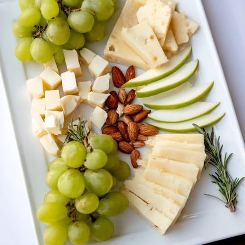 This Book Club Pairing Platter features fragrant rosemary dividing sections of delicious appetizers for any wine.