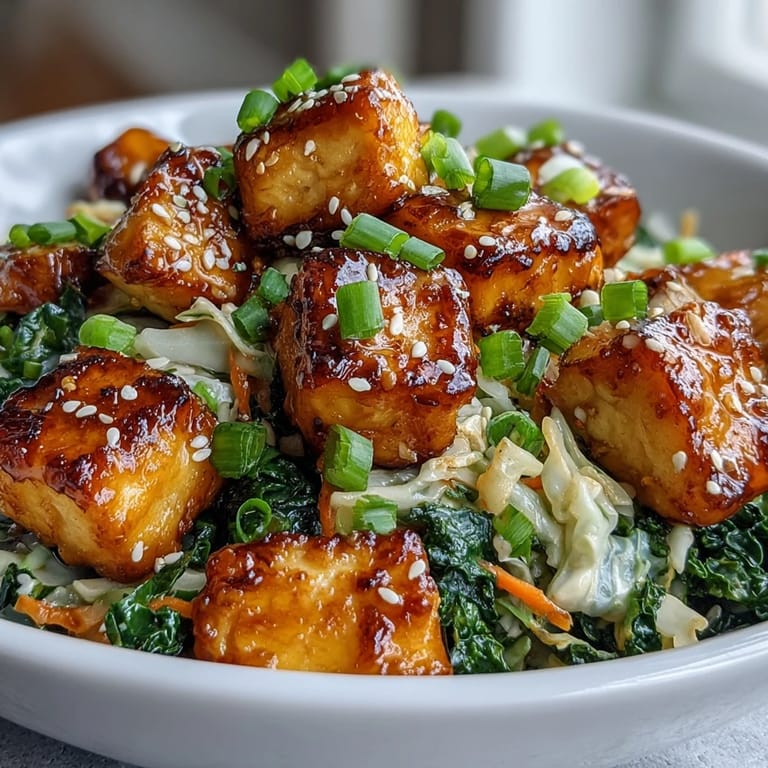 Vibrant julienned carrots and green onions top this easy Tofu Egg Roll in a Bowl, ready to serve with chopsticks.