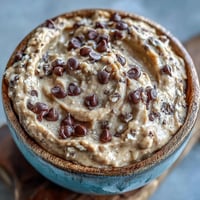 Creamy fiber-packed chickpea cookie dough dip, no-bake, with chocolate chips.